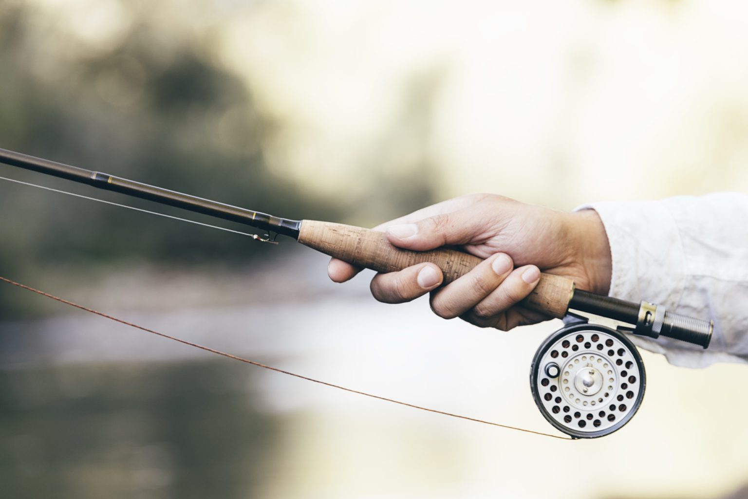 A fly rod and reel on the water near Mahahual