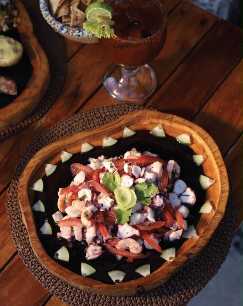 Ceviche mixto with a michelada
