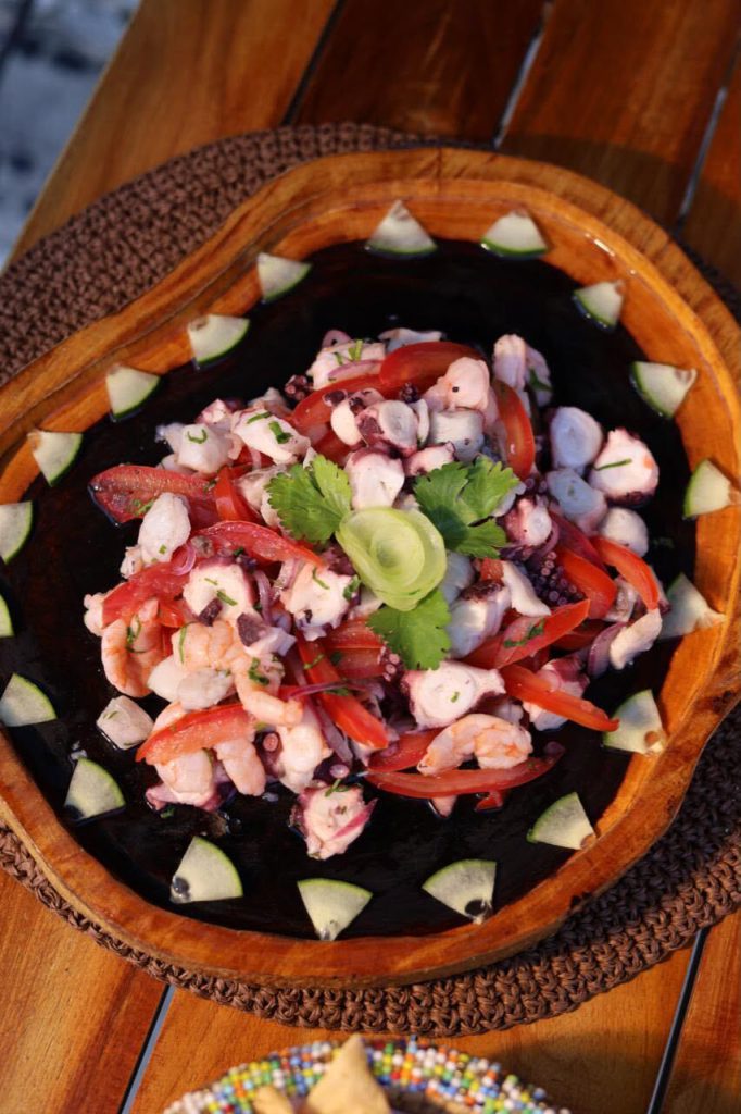 Ceviche mixto in a wooden bowl